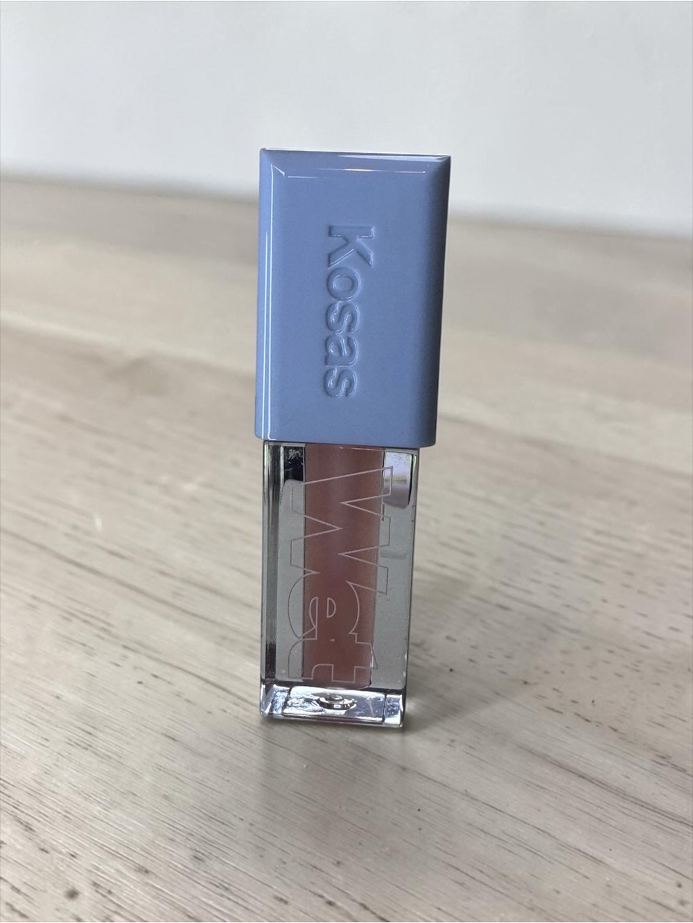 Kosas Gloss in Nude Beige with Lavender Cap
